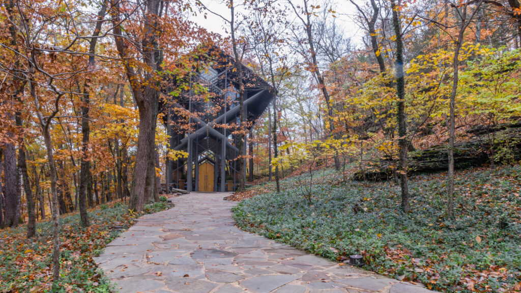 Thorncrown Chapel in the Ozark Mountains near Eureka Springs Arkansas.  Treelined path with autumn colors.